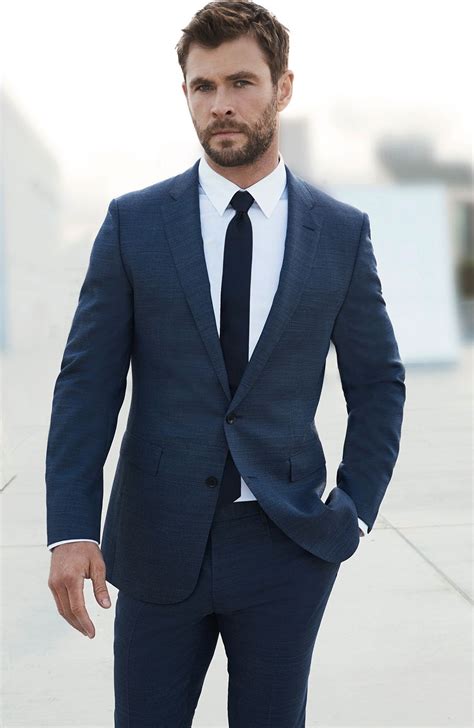 navy suit with black tie